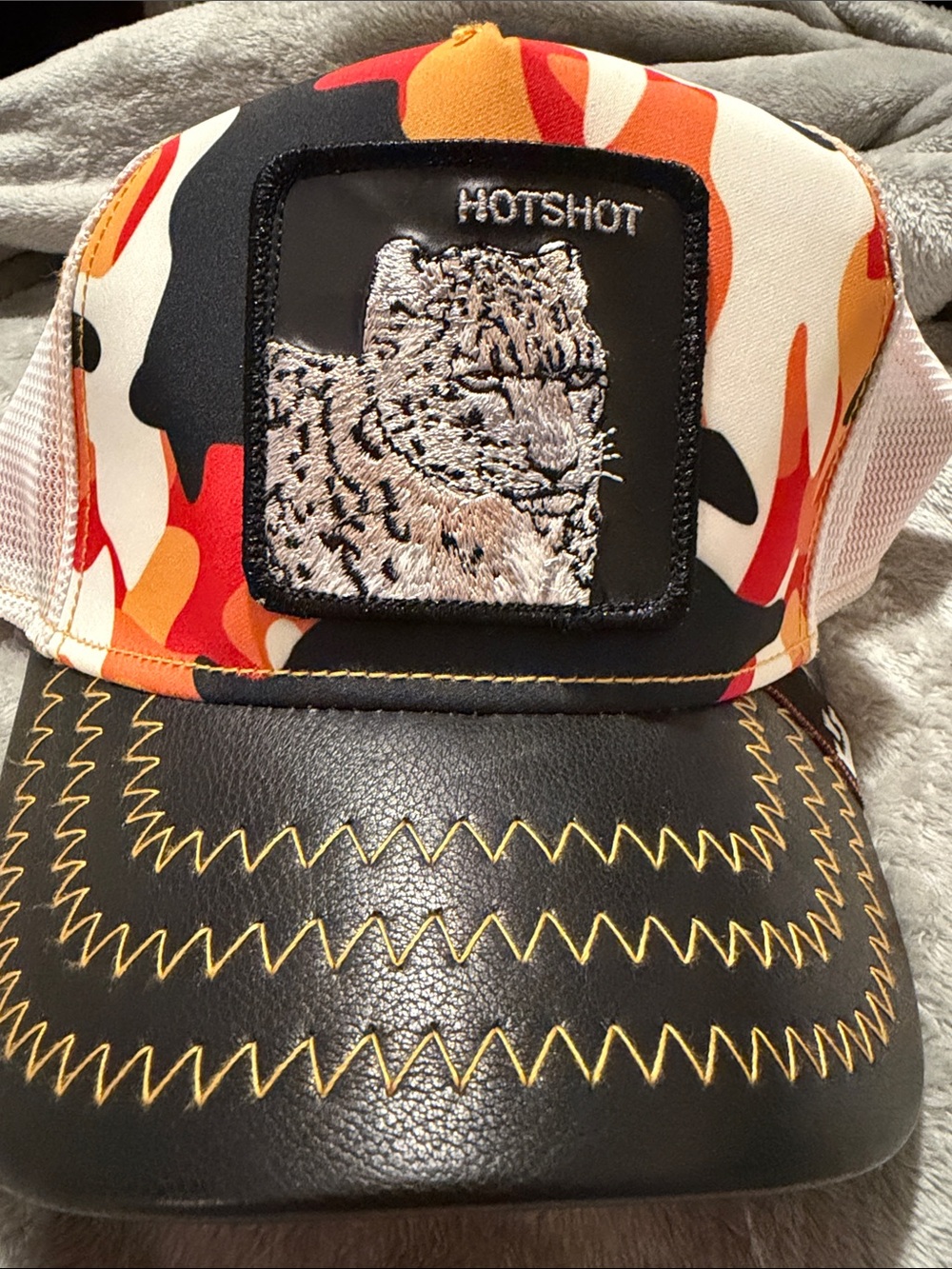 HOTSHOT Orange Camo Trucker Hat with Leopard Patch